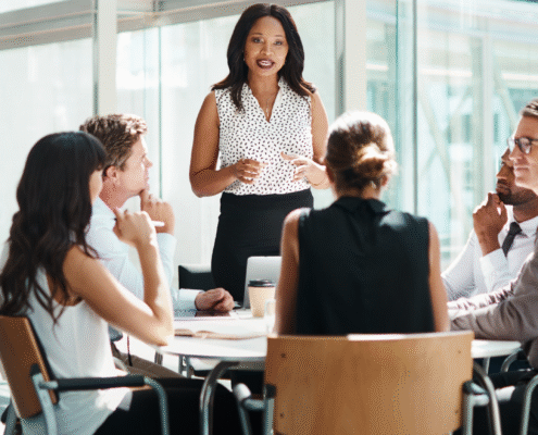 Group of professionals discussing HR trends for 2026.