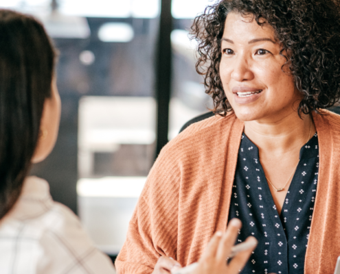 Two women talking in a job interview.