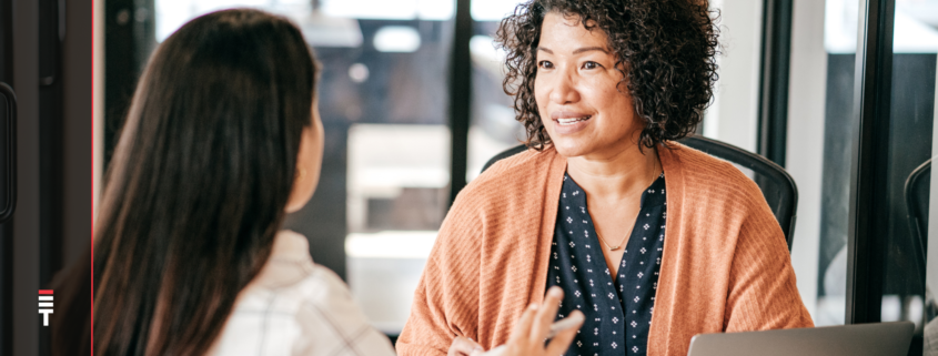 Two women talking in a job interview.